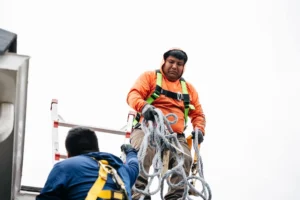 Solar installation technicians working on a commercial rooftop